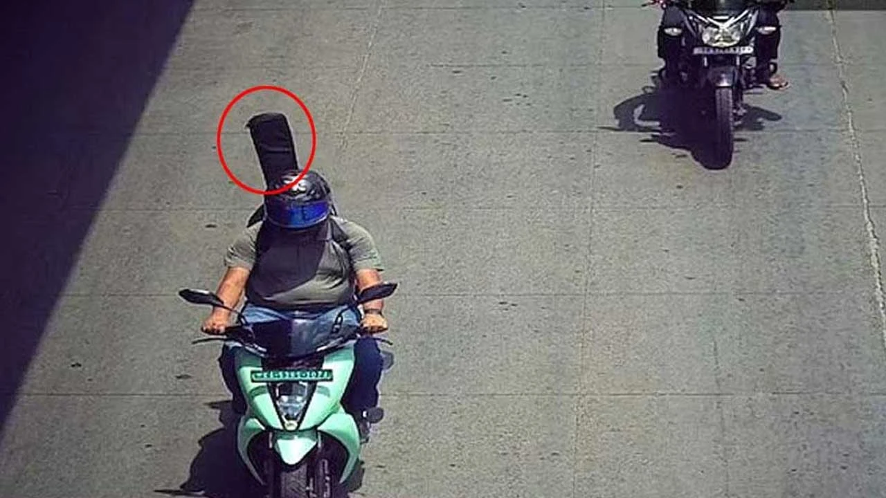 গিটারকে যাত্রী ভেবে হেলমেটের মামলা দিল ‘এআই ক্যামেরা’